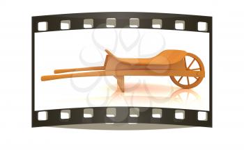 wooden wheelbarrow on a white background. The film strip