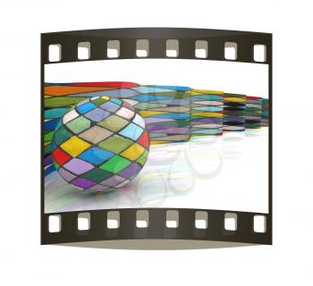 The mosaic ball against the background of colorful waves. The film strip