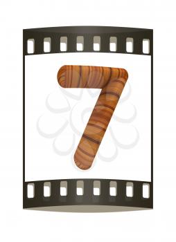 Wooden number 7- seven on a white background. The film strip