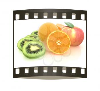 slices of kiwi, apple, orange and half orange on a white. The film strip