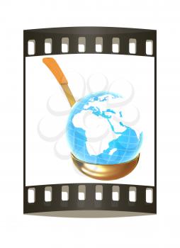 Blue earth on gold soup ladle on a white background. The film strip