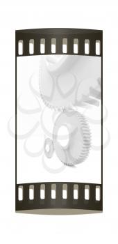 White background consisting of bright gears and arrows.The concept of motion. The film strip 
