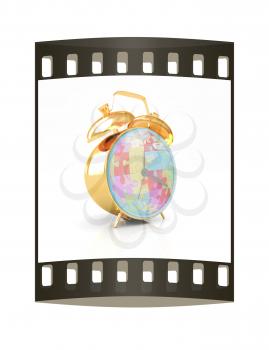 Gold alarm clock on a white background. The film strip
