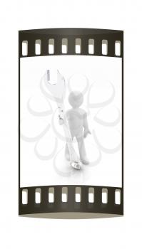 3d man - wrench in hands on a white background. The film strip