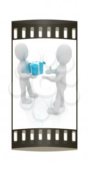 3d man gives gift on a white background. The film strip