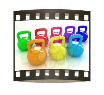 Colorful weights on a white background. The film strip