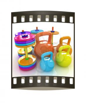 Colorful weights and dumbbells on a white background. The film strip