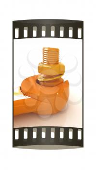 Colorful wrench to tighten the screws on a white background. The film strip