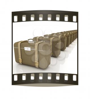 Brown traveler's suitcases on a white background. The film strip