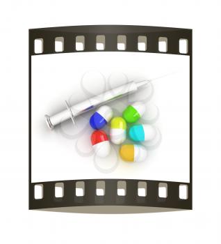Pills and syringe on a white background. The film strip