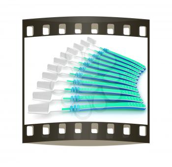 Toothbrushes on a white background. The film strip