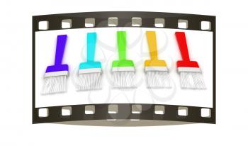 Colorful paint brushes on a white background. The film strip