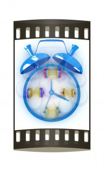 Alarm clock icon with dumbbells. Sport concept on a white background. The film strip