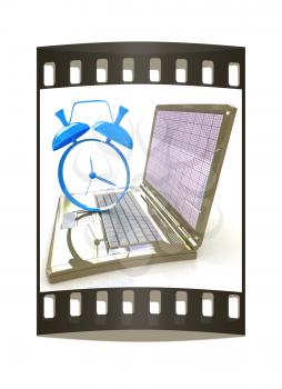 Notebook and clock on a white background. The film strip