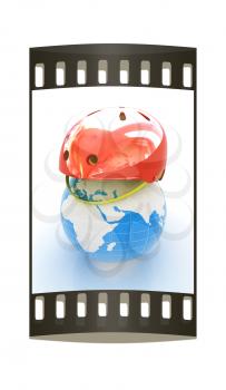 Bicycle helmet on earth. The concept of healthy life and sport on a white background. The film strip