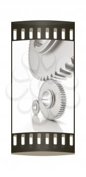 White background consisting of bright gears and arrows.The concept of motion. The film strip