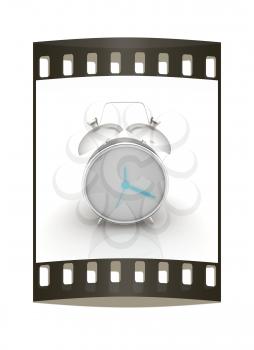 Alarm clock on a white background. The film strip