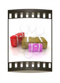 Traveler's suitcases. Family travel concept. The film strip