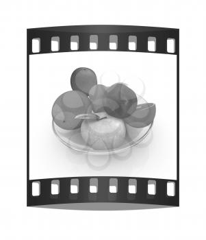 Citrus and apples on a white background. The film strip