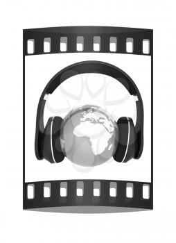 earth with headphones. World music concept isolated on white. The film strip