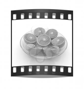 half oranges on a plate on a white background. The film strip