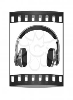 Golden headphones on a white background. The film strip