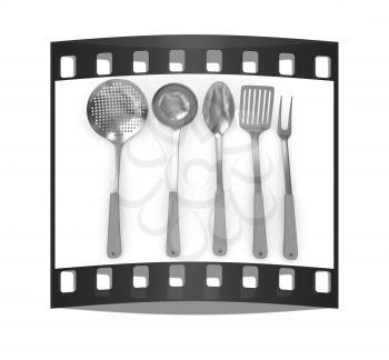 Gold cutlery on a white background. The film strip