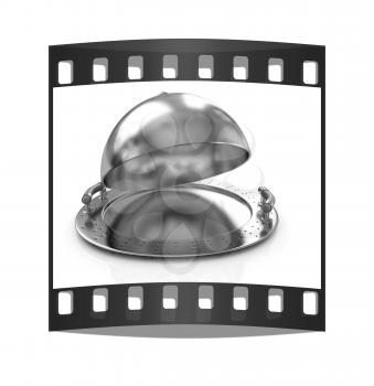 Glossy golden salver dish under a golden cover on a white background. The film strip