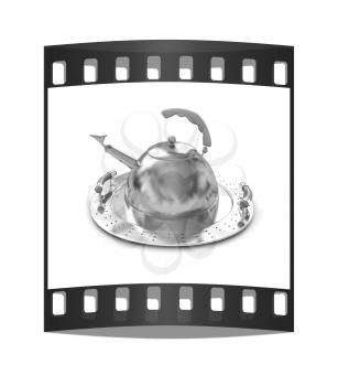 Gold teapot on platter on a white background. The film strip
