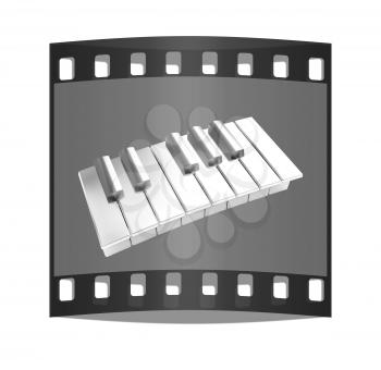 Piano on a blue background. The film strip