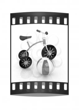 children's bike with colorful aquatic ball on white background. The film strip
