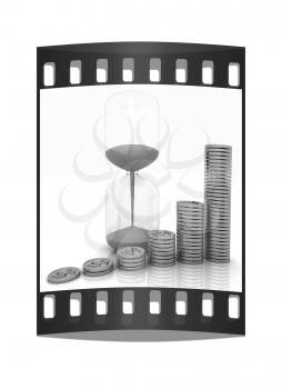 hourglass and coins on a white background. The film strip
