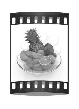 Citrus in a glass dish on a white background. The film strip