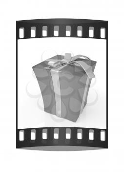 Red gift with gold ribbon on a white background. The film strip