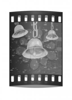 Gold bell on winter or Christmas style background with a wave of stars. The film strip