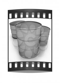 Metal barrels on white background. The film strip