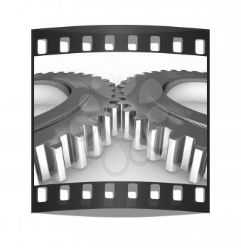 Gear set on a white background. The film strip