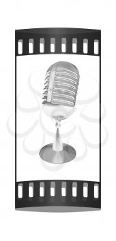 metal microphone on a white background. The film strip