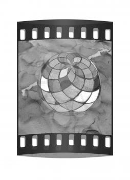 Mosaic ball on a colorful background. The film strip
