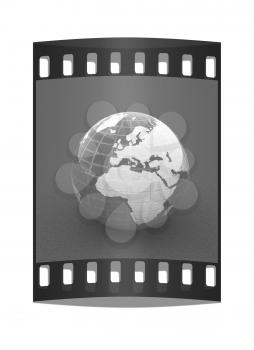 Earth on a green background. The film strip