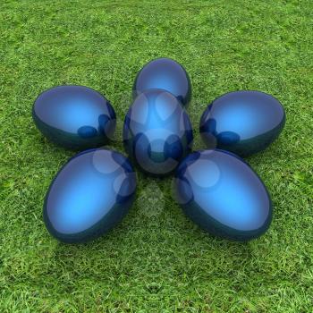 Metallic blue Easter eggs as a flower on a green grass
