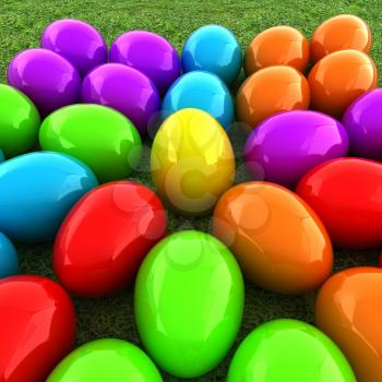 Colored Easter eggs as a flower on a green grass