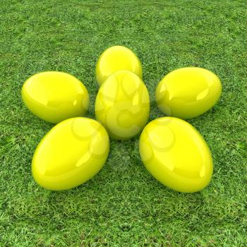 Yellow Easter eggs as a flower on a green grass