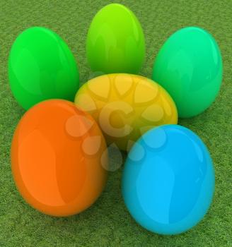 Colored Easter eggs on a green grass