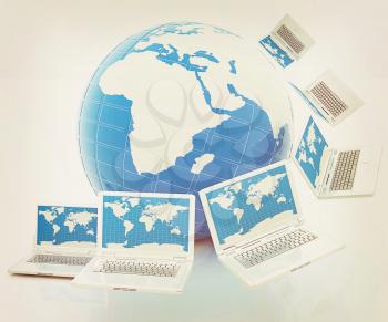 Laptops around the planet earth . 3D illustration. Vintage style.