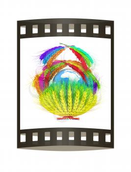 A colorful basket of wheat for Easter or Thanksgiving. Global concept with the earth ball inside. 3d render. Film strip.