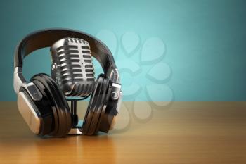 Vintage microphone and headphones on green background. Concept audio and studio recording. 3d