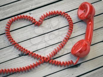 Phone reciever and cord as heart on white wooden background. Love hotline concept. 3d illustration