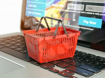 Online shopping e-commerce concept. Shopping basket on laptop keyboard. 3d illustration