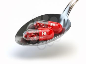 Pills with iron FE ferrum element in spoon. Dietary supplements. Vitamin capsules. 3d illustration